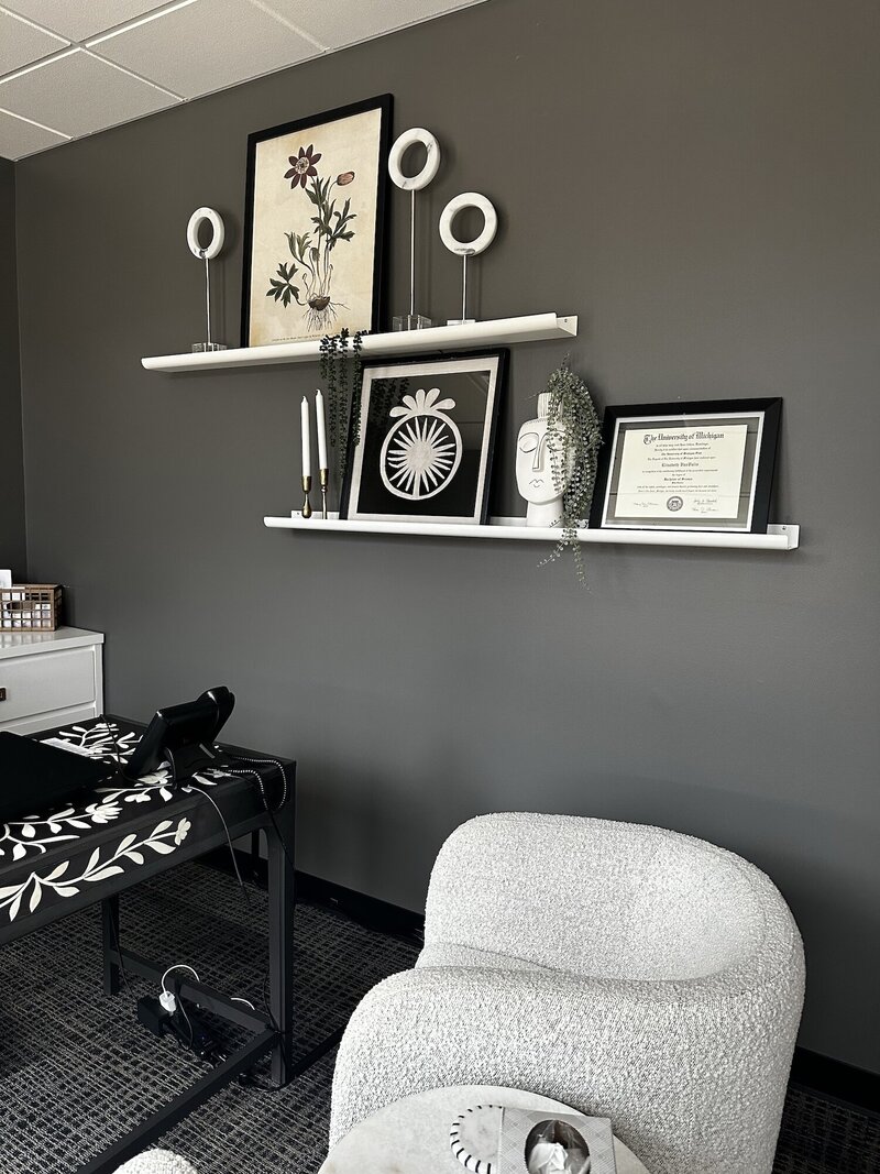 Arrangement of frames and other decorative items on a wall
