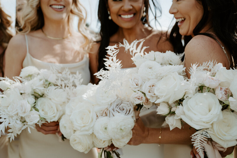 Detail of bridal bouquet with ruffled garden roses in sand and mauve, white ranunculus, and bleached fern at Jenay and Daniel’s wedding, by Summer Robbins Flowers in Central Oregon
