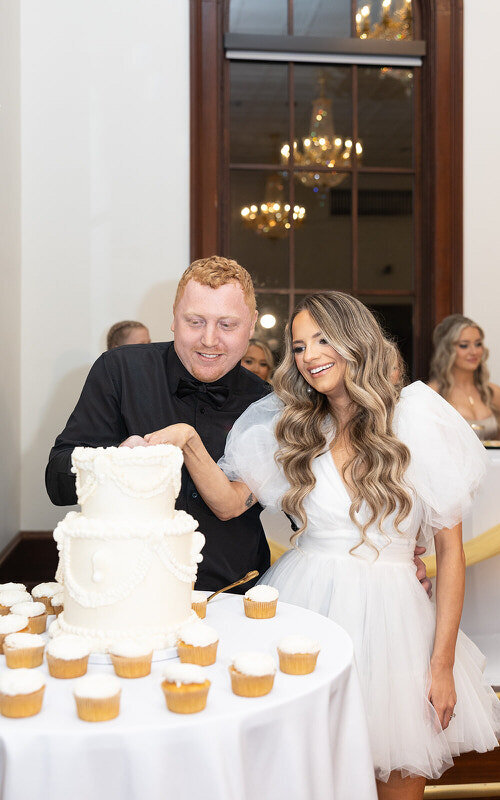 Bride and groom cutting cake at a Palm Coast wedding venue