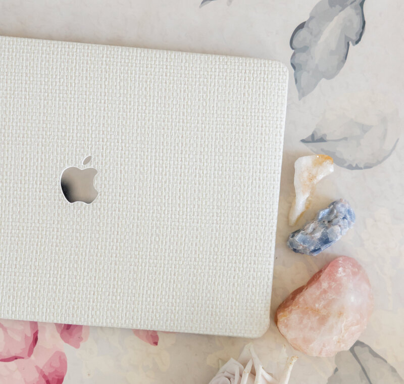 flatlay of laptop and crystals