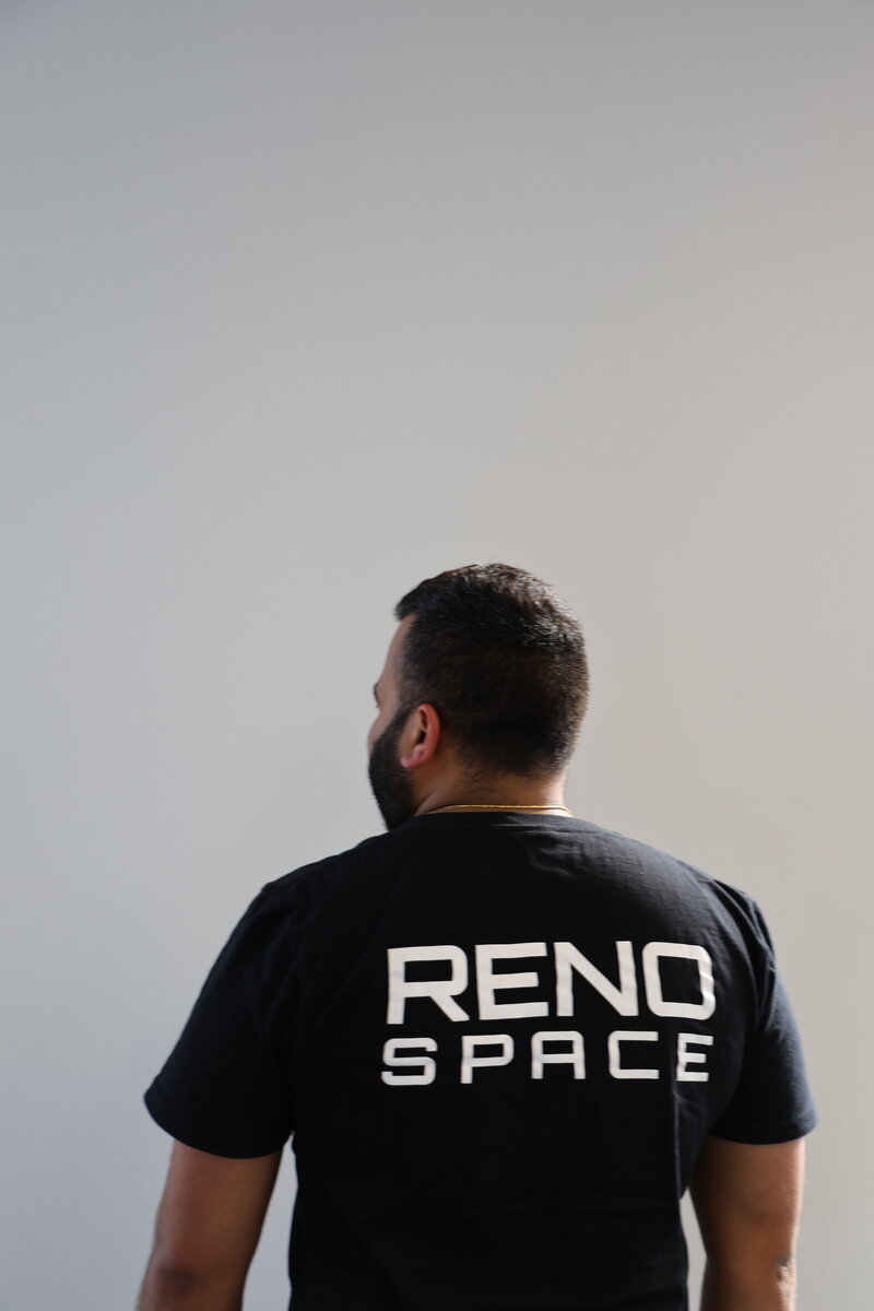 employee in reno space t shirt showing the logo