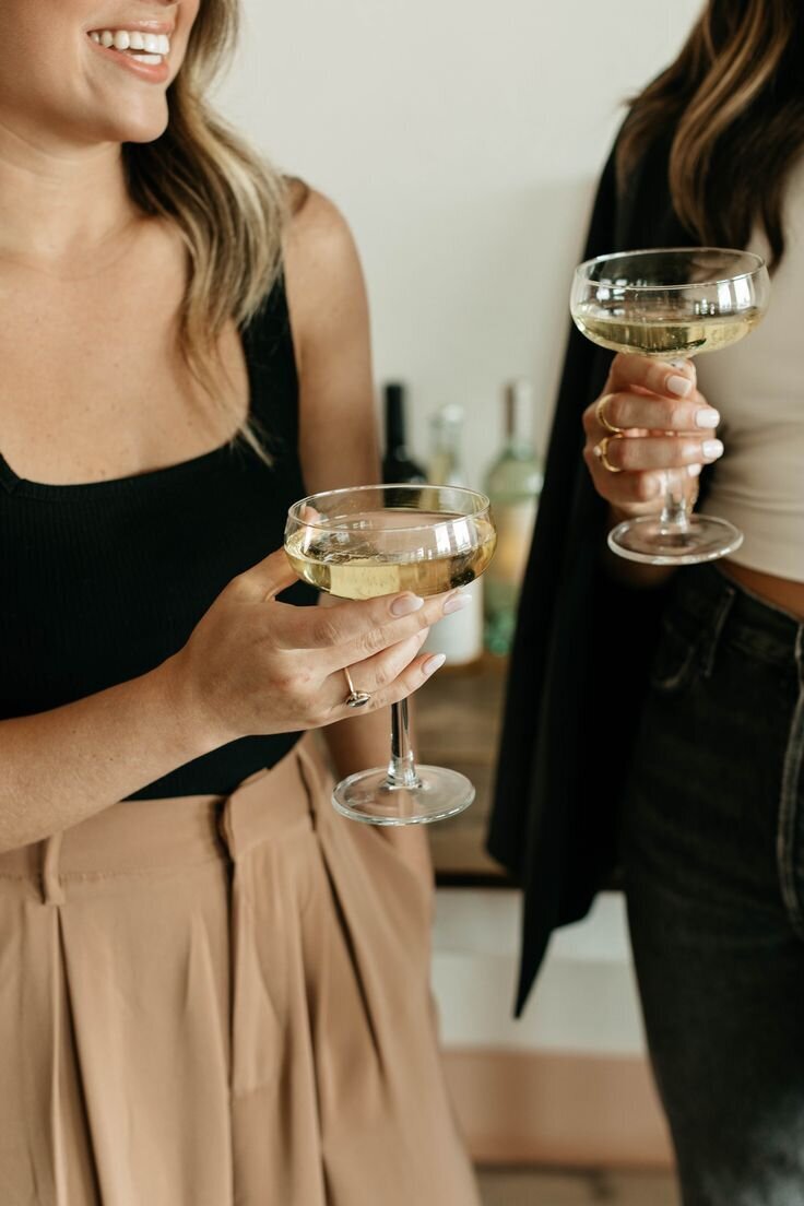 Team toasting with champagne — a peek into the celebration-loving culture at Well-Dressed Events.