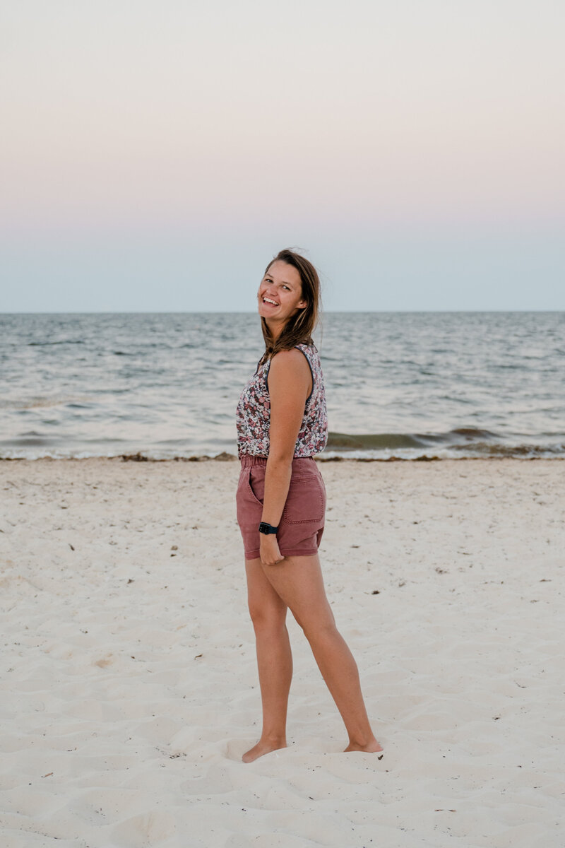 Newlyweds relaxing by the ocean, soaking in the beauty of Hawaii on their honeymoon.