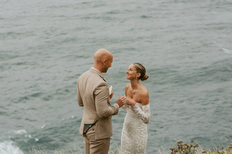 Elopement couple walking along grassy path in Oregon