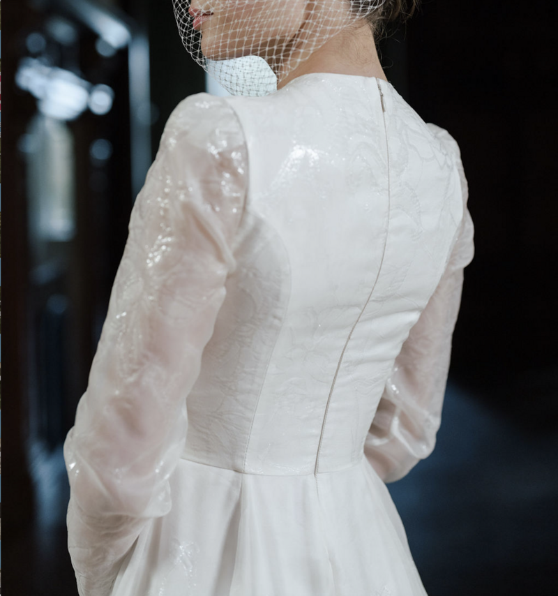 close up of a bride wearing a wedding dress