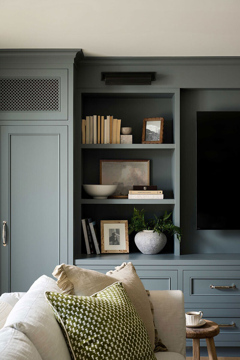 Custom home design with built-in entertainment center and soft color palette in Mesa Verde