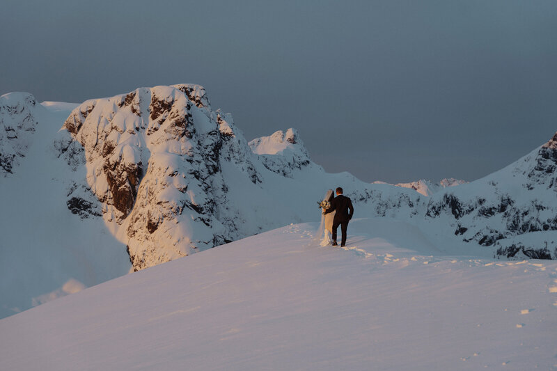 Bride and groom near the Comox Glacier during their sunrise helicopter elopement by latitude 49 photography
