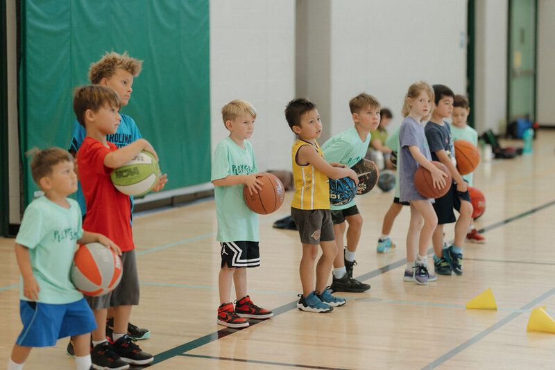 Kids lining up to play basketball