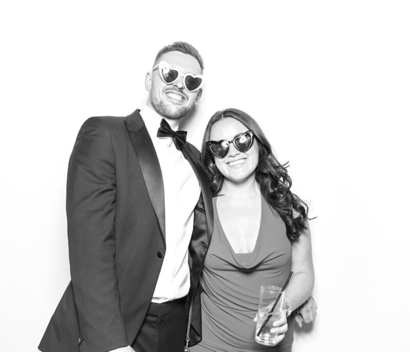 B&W image of 2 guests during a 25th company celebration, for Hedsor House event entertainment