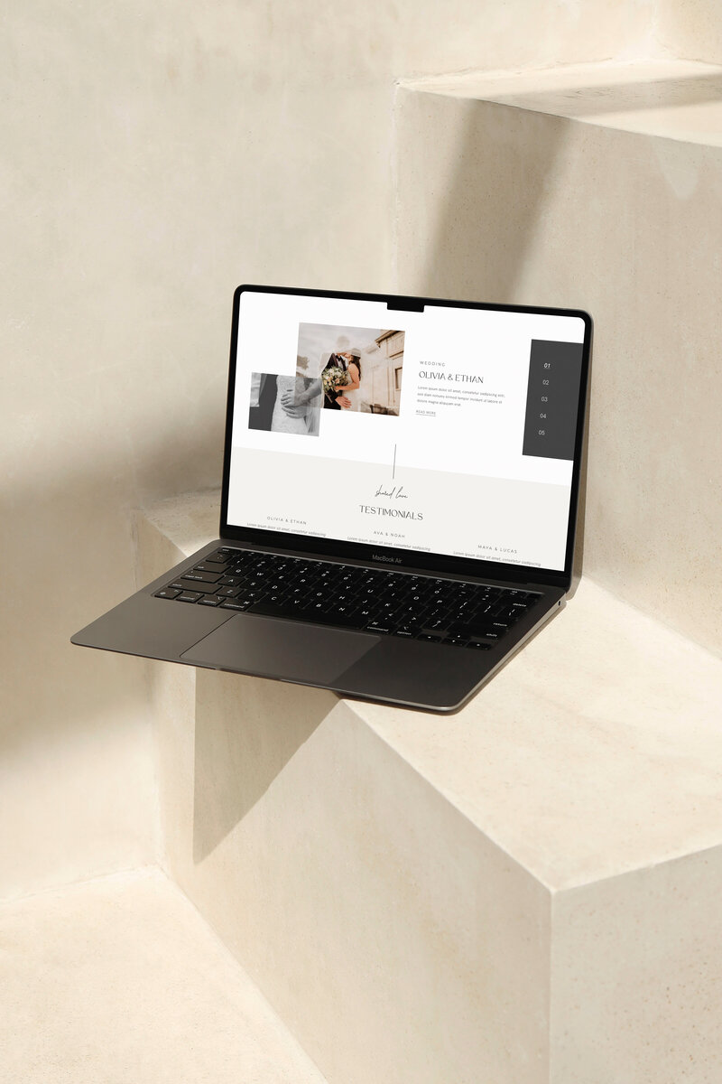Laptop on stairs shows Wedding Photography Webite