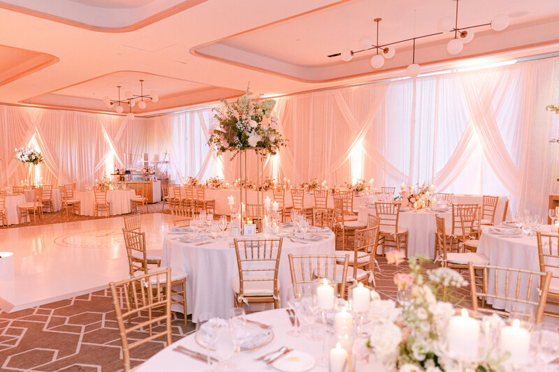 Their venue with large floral centerpieces.