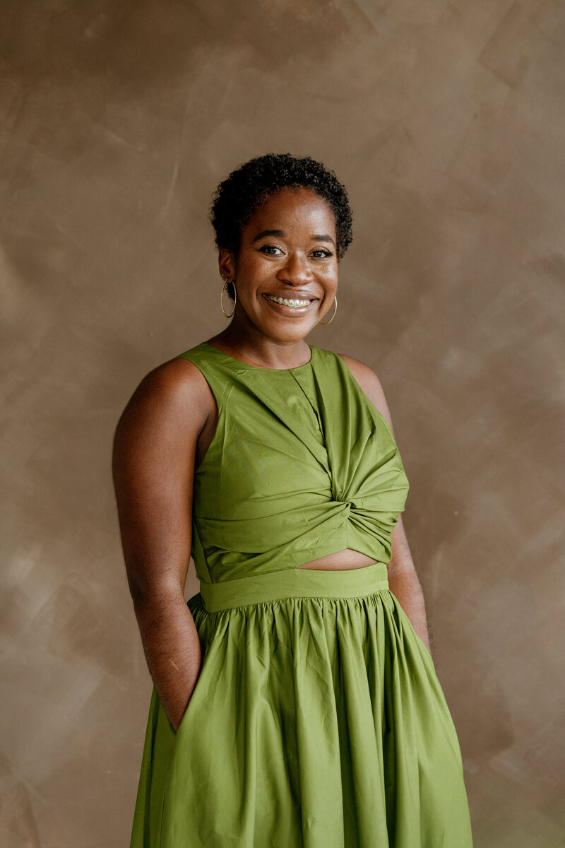 GIF of a woman laughing and dancing.