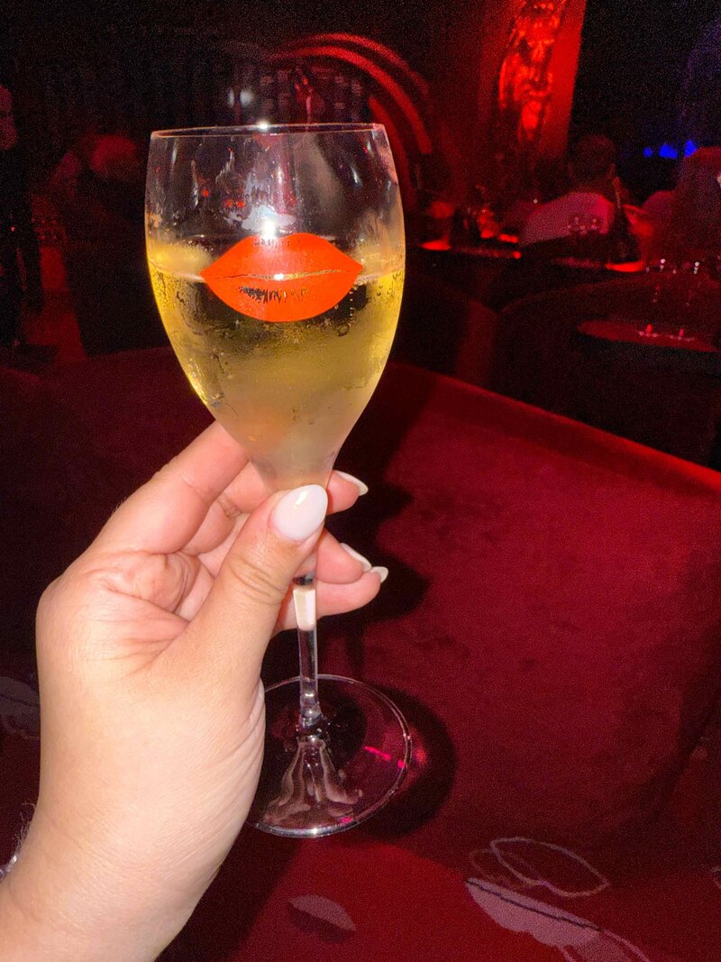 Celebration of starting the custom wedding invitation process with a champagne toast