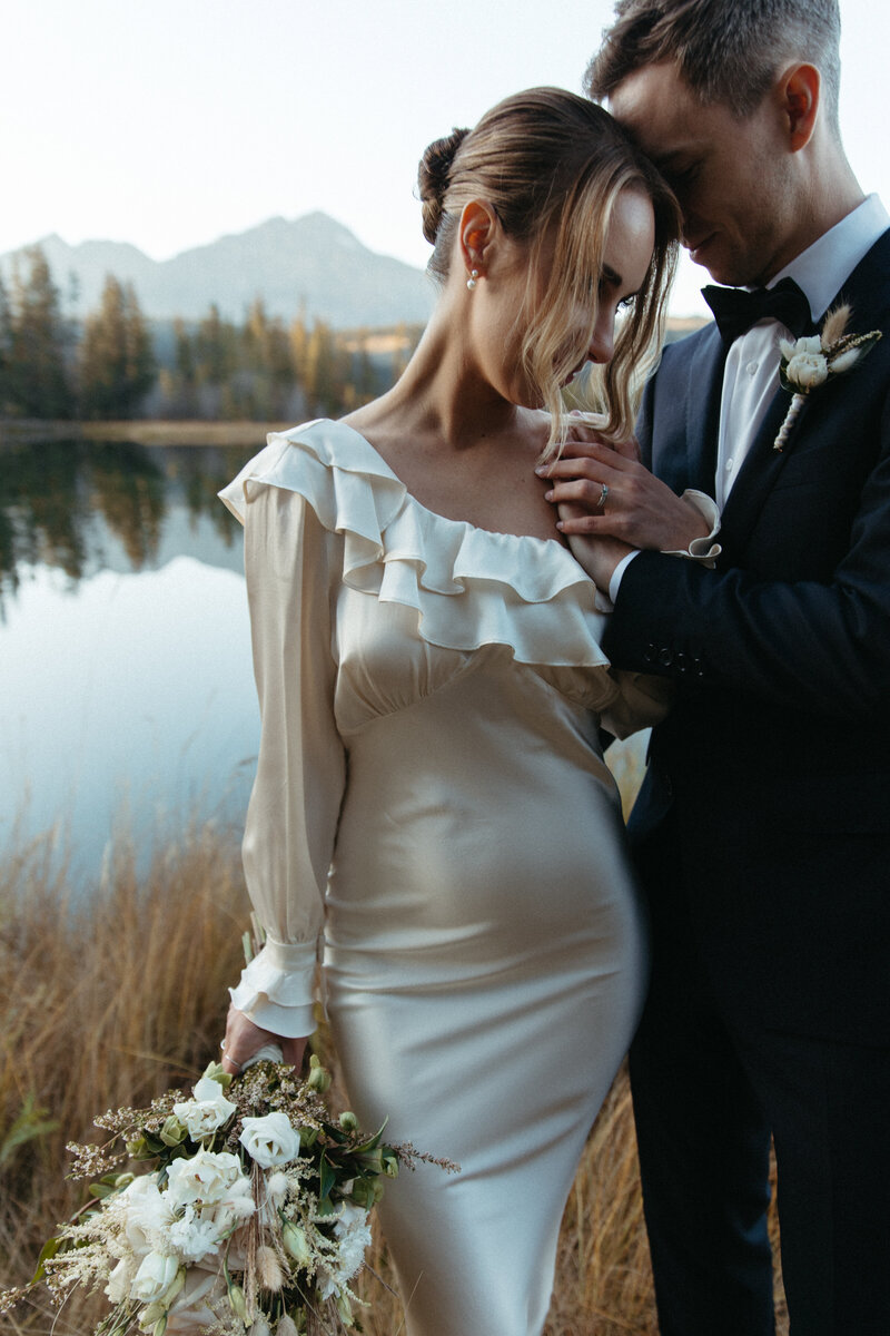 engaged couple holding hands outdoors on an adventure