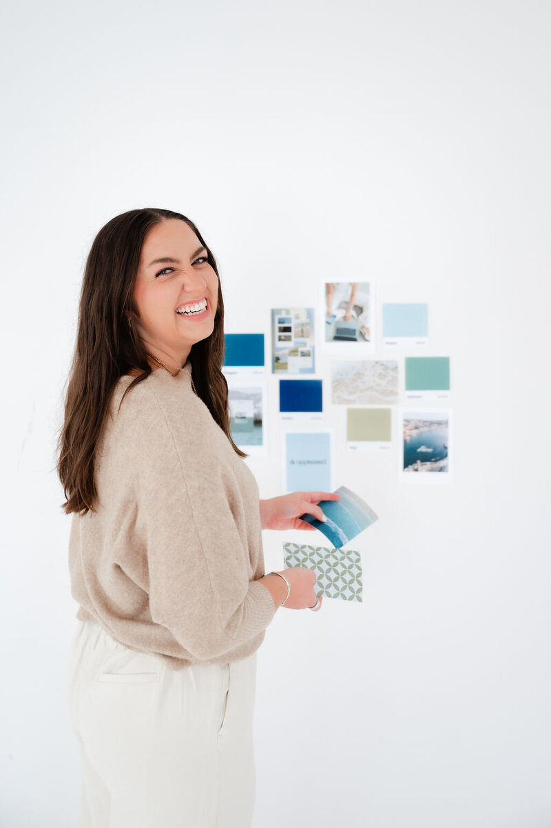 Image showing a designer working on branding and Showit web design for small businesses