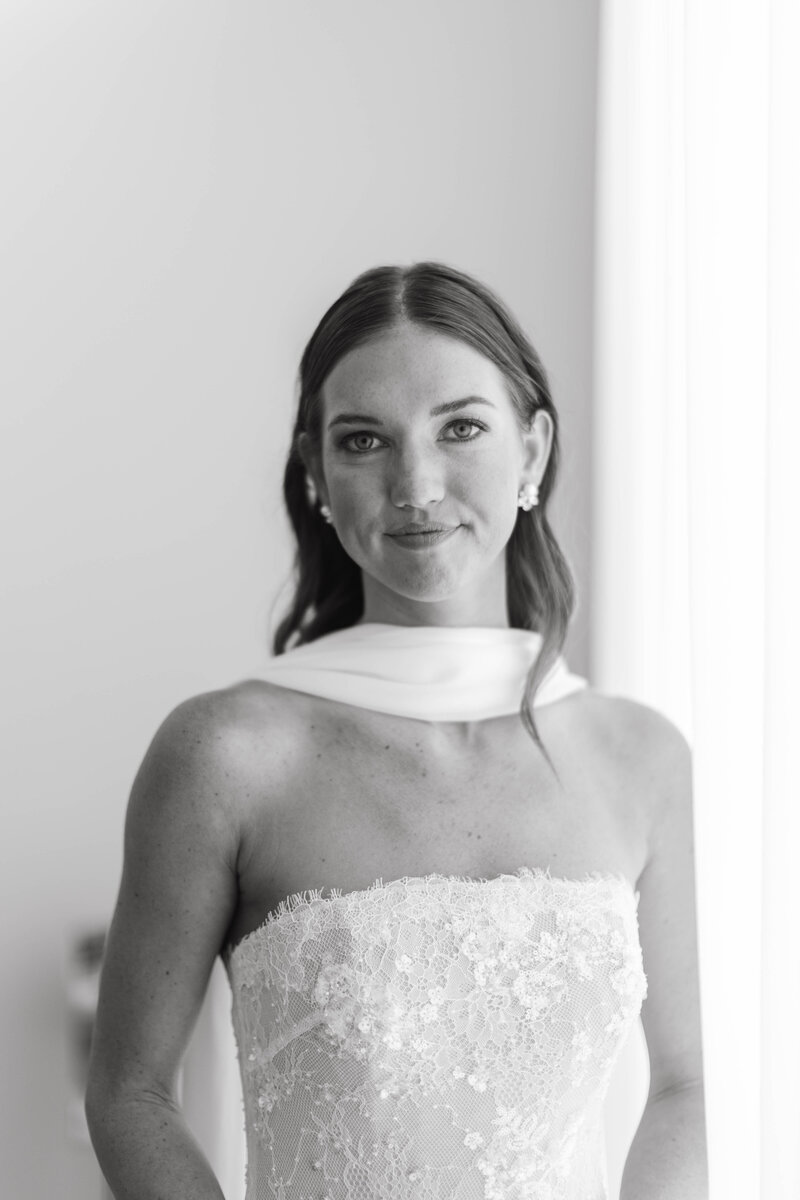 Soft natural light portrait of bride in strapless gown and silk scarf, captured by Clar Barron Photo.