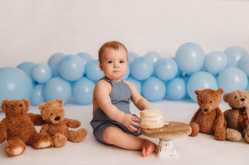 Family Poses with their Infant during Newborn Photoshoot in Asheville, NC.
