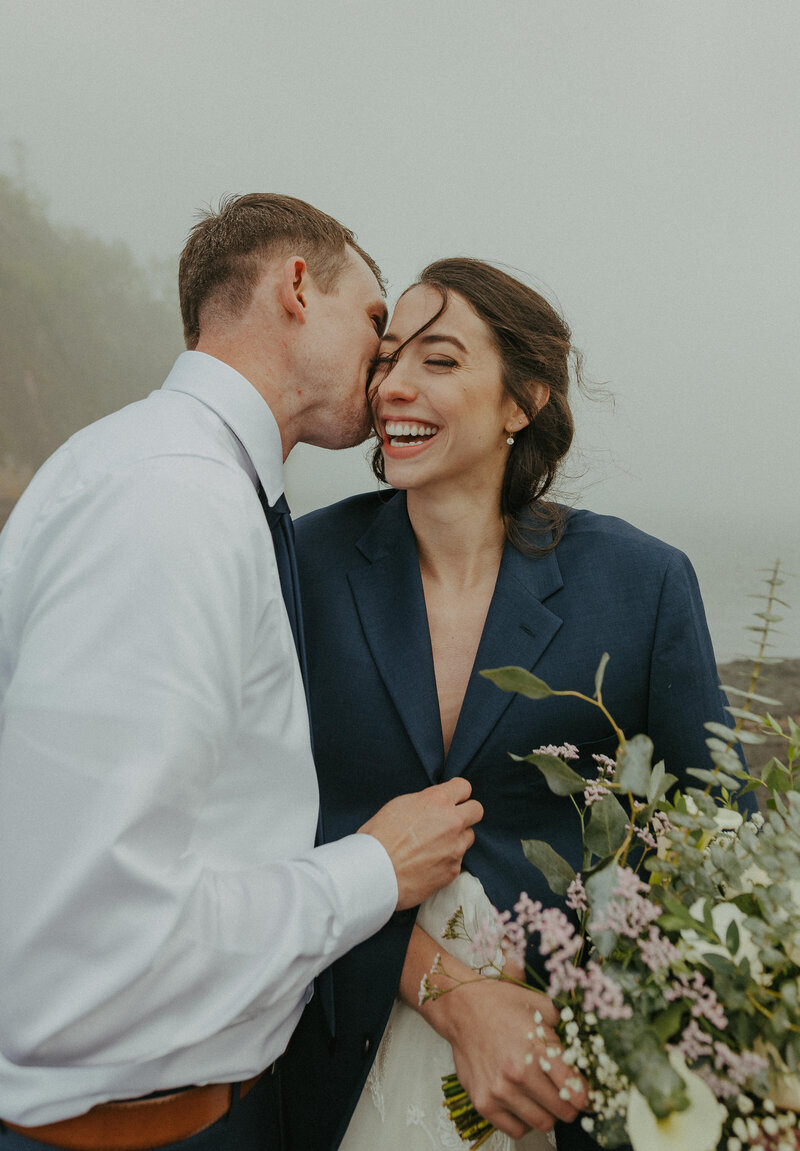 A married couple on their elopement day at Crouching Lion Hike on the island of Oahu Hawaii