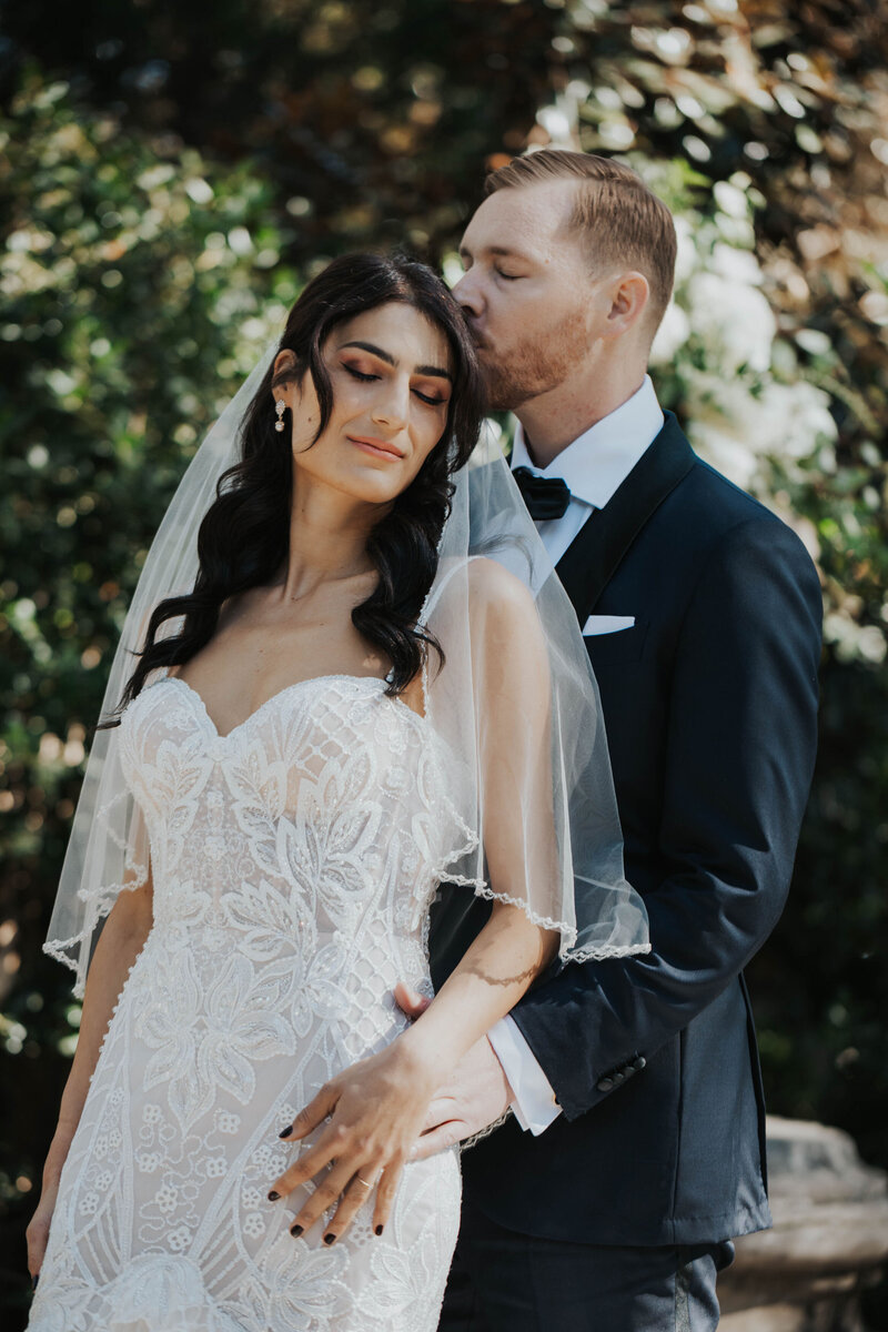 groom kissing bride