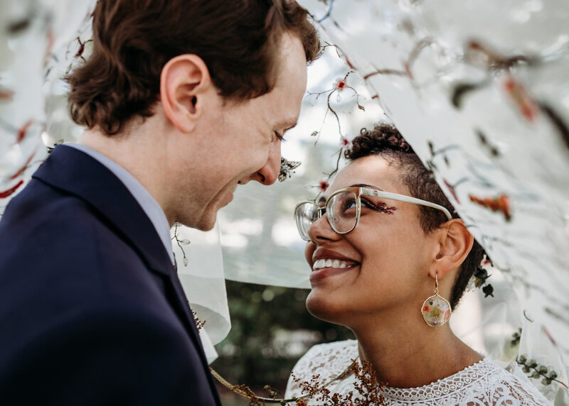 Bryan and Tahlia Townsend under Tahlia's  wedding cape at the Myriad Gardens in Oklahoma City.