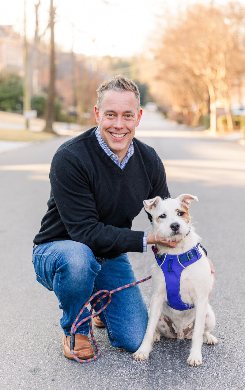 real estate agent with his dog during personal brand photo session with Atlanta brand photographer Laure Photography