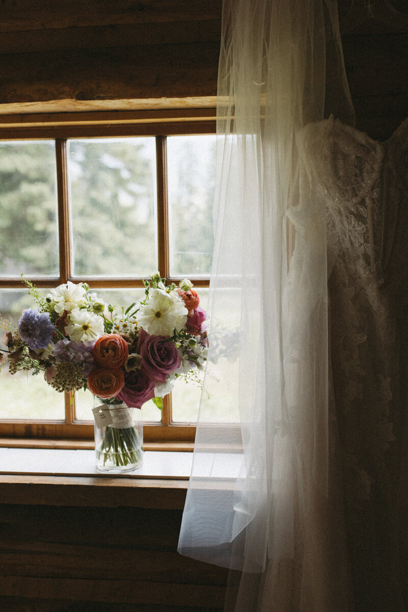 bridal dress and wedding bouquet captured by fernie wedding photographer