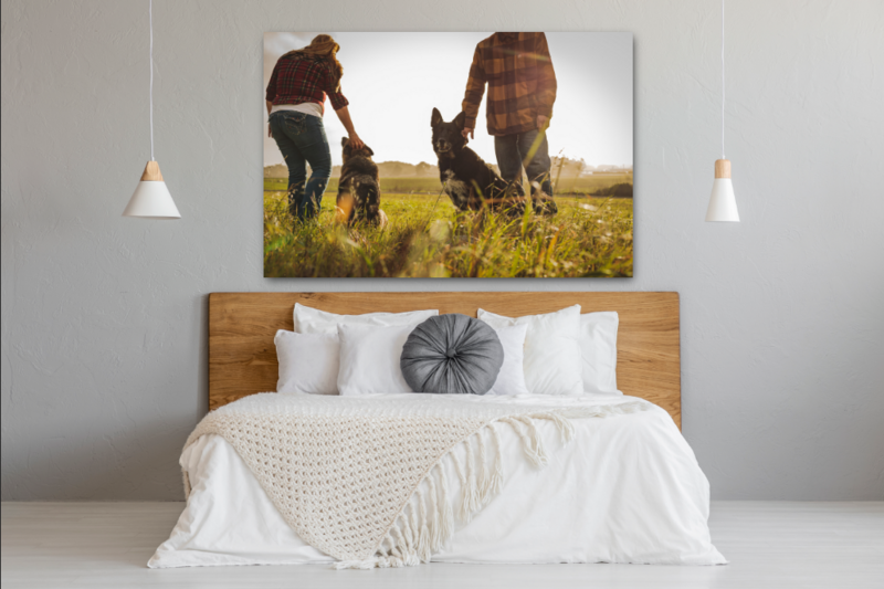 Large print hanging over bed in bedroom