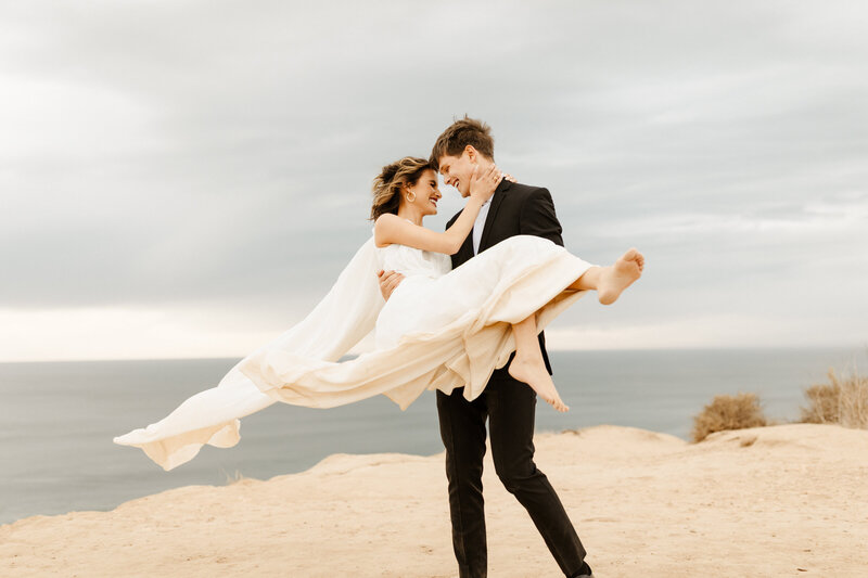 bride and groom at cliffside elopement in Malibu