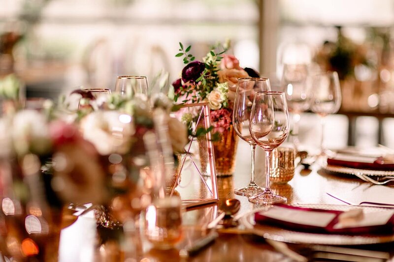 This elegant photograph captures the evening reception setup at Venue 308, a historic building with charming details that create a warm and inviting atmosphere for wedding celebrations.