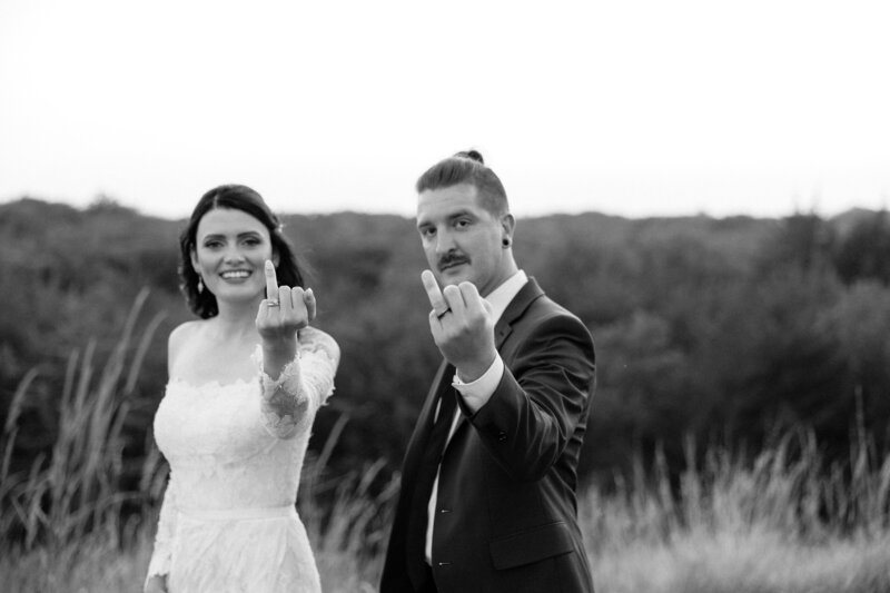 A couple showing off their wedding rings.
