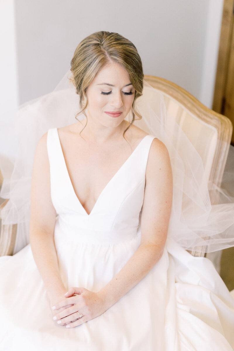 Bride getting ready in Canyonwood Ridge bridal suite with natural light and soft details