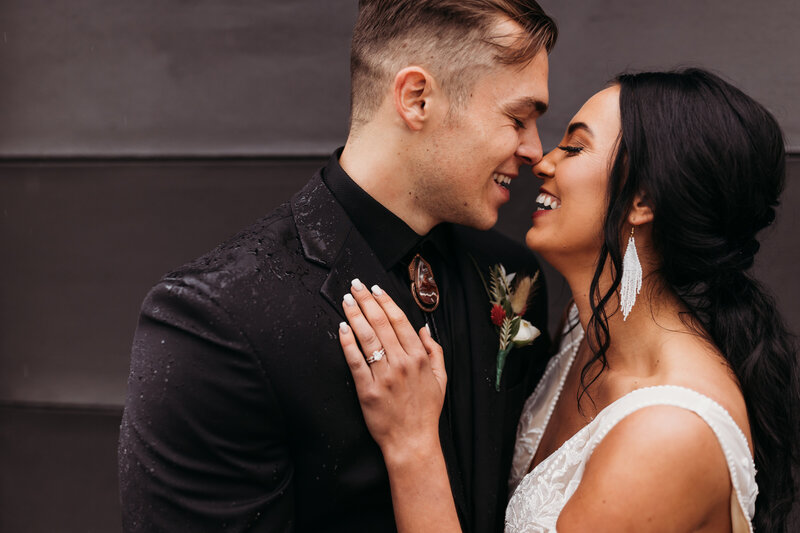 Wedding session photo of couple nose touching