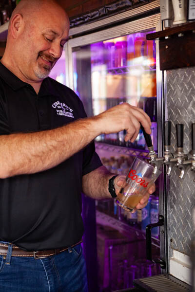 Nate pouring cold beer on tap at Conway's Pub & Eatery