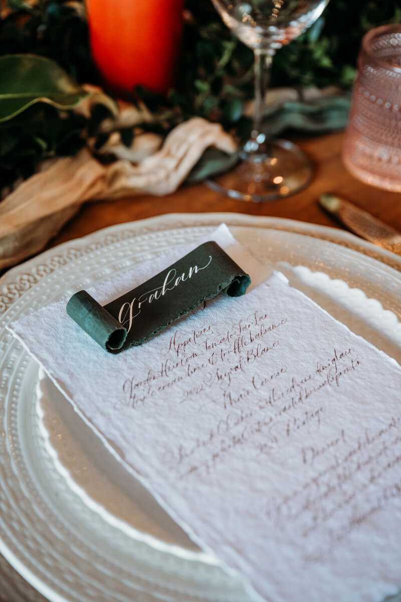 place card with custom calligraphy for a menu