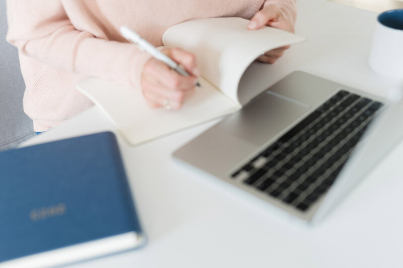 Woman writing in journal