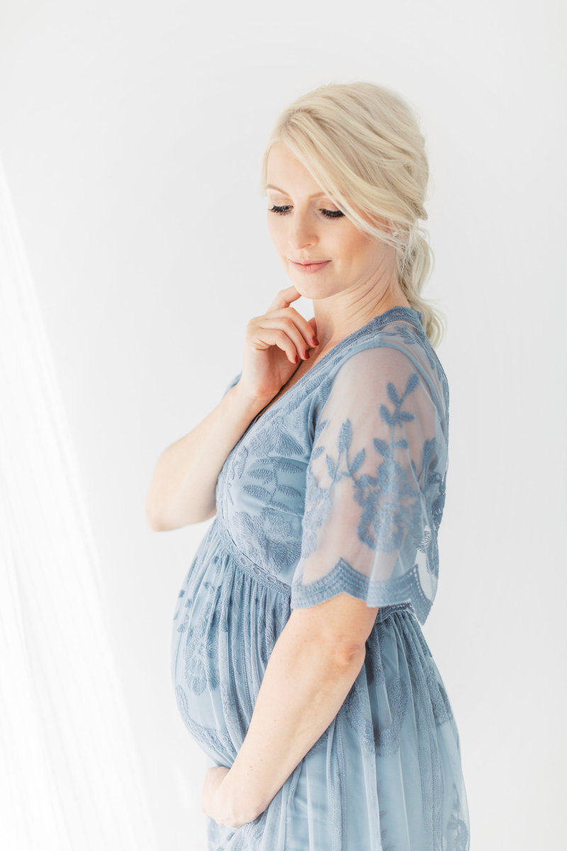 Pregnant woman in blue dress