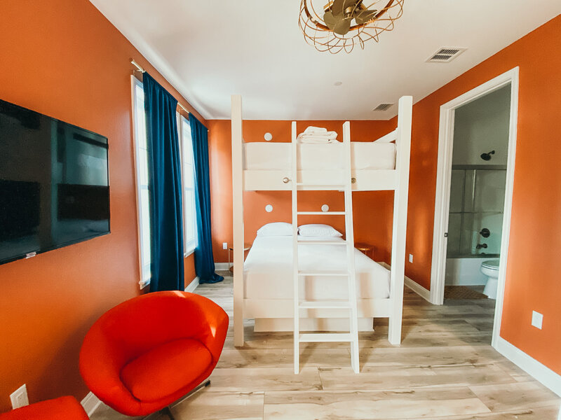 orange bedroom with white bunkbeds