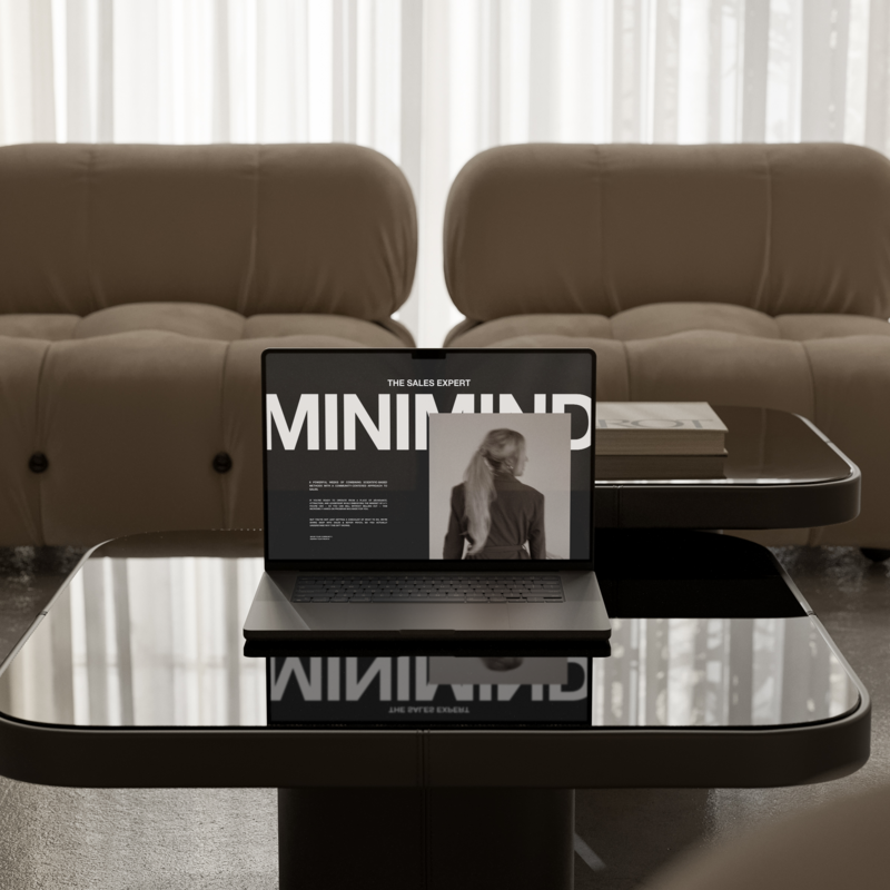 a macbook on top of a chic black table with business strategist natasha zoryk's The Sales Expert Minimind group program