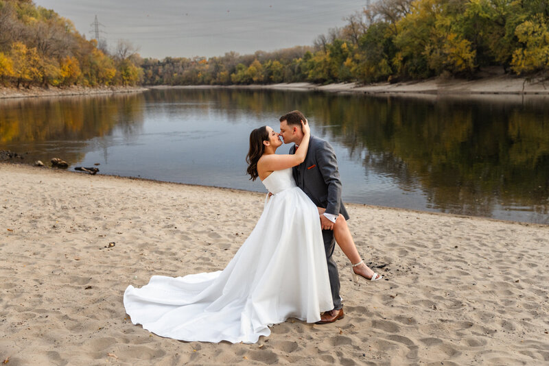 bride and groom near lake