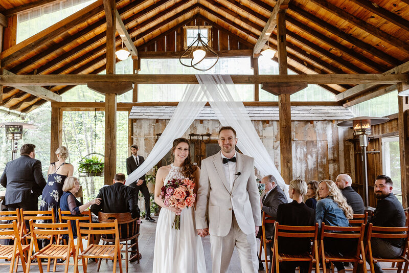 A bride and groom come down the aisle during their elopement with family at Drumore Mill. Pennsylvania Elopement Photographer
