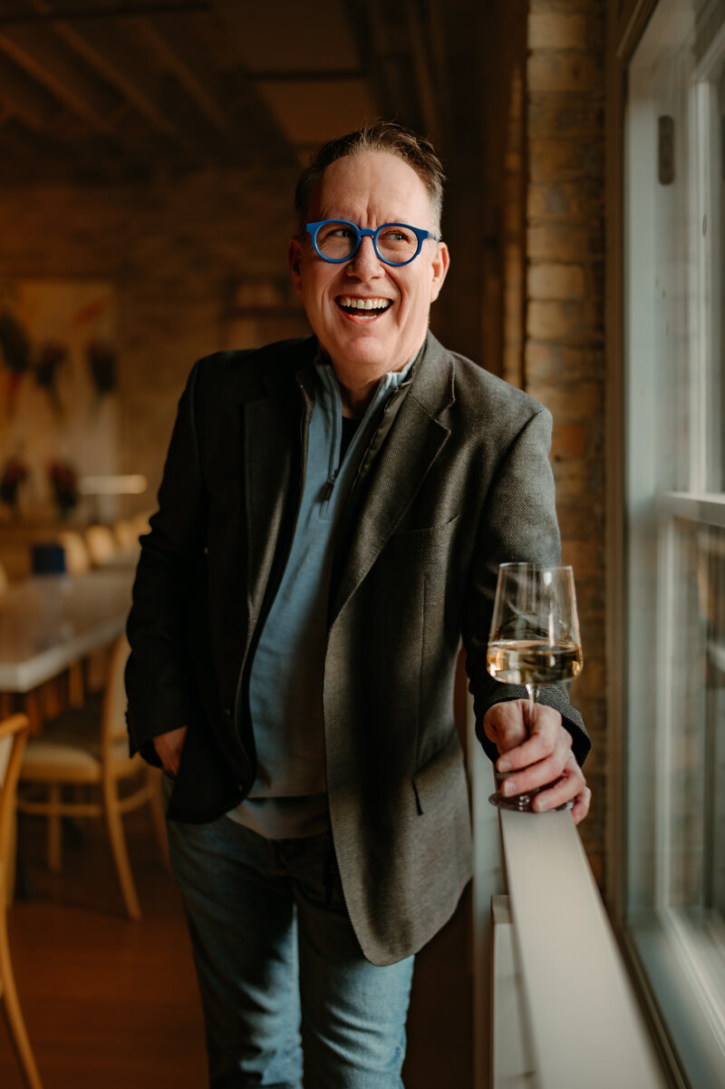 Client laughing during candid dating profile session in Minneapolis with Shannon Kathleen Photography