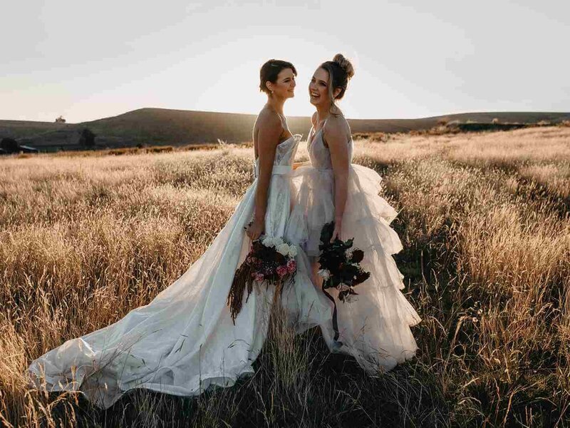 brides standing in field