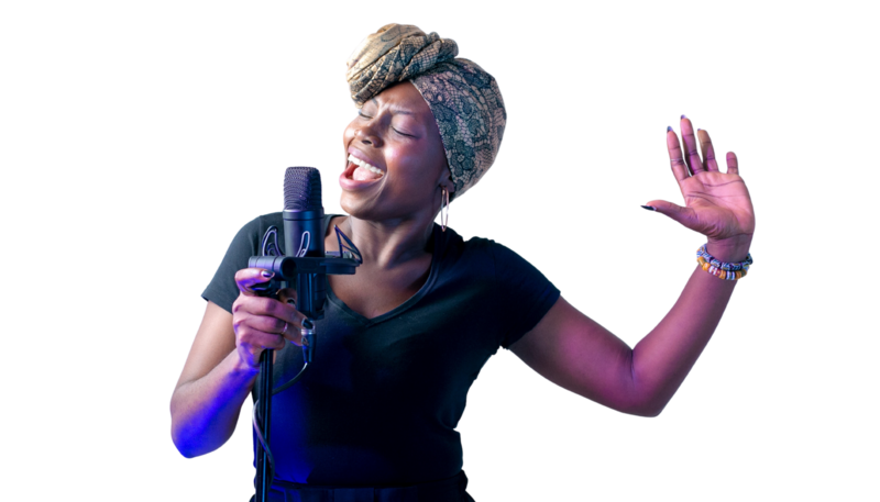 Woman singing into microphone with her eyes closed