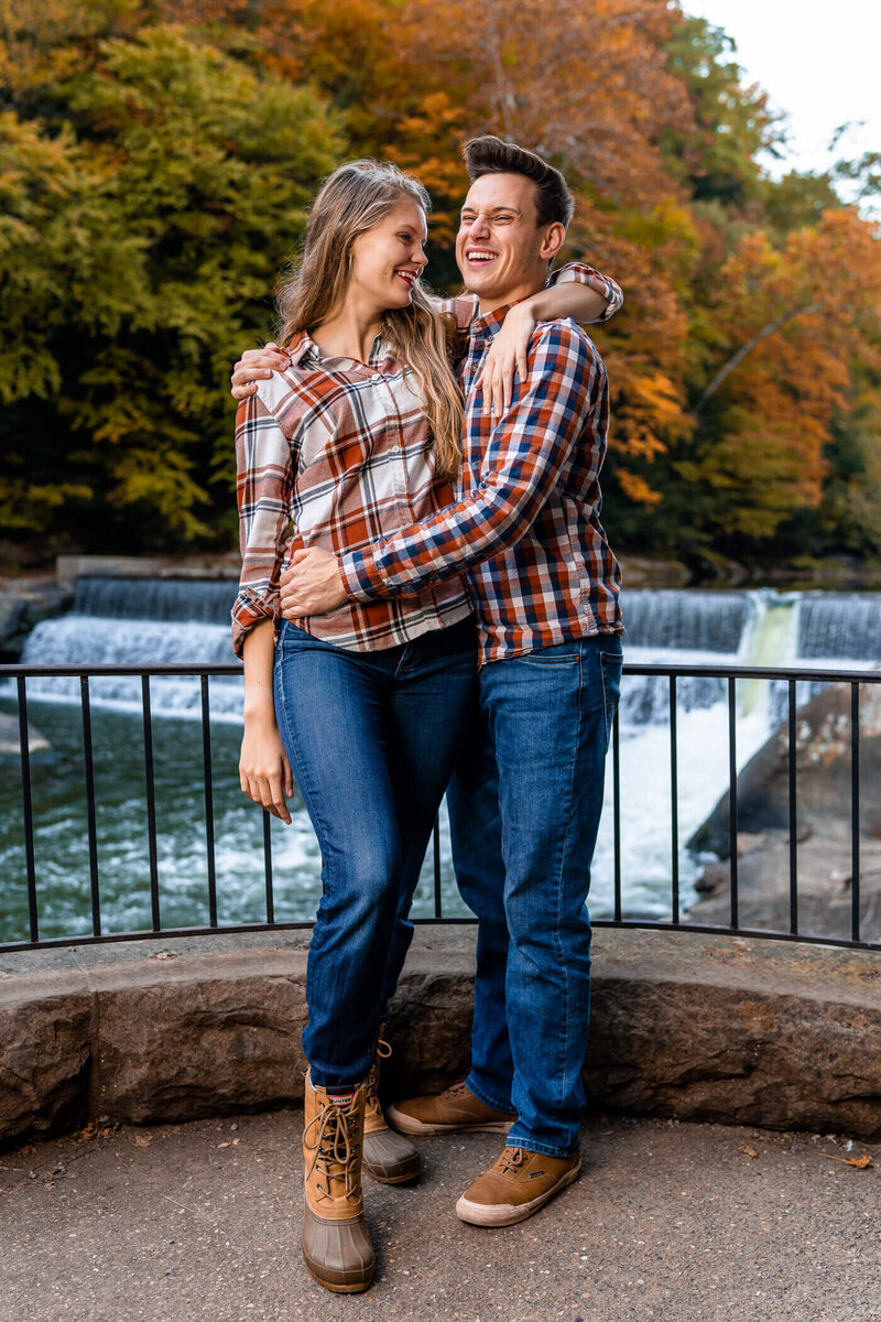 Portrait of Michael and Deidra laughing together during a portrait session at McConnell's Mill State Park, PA