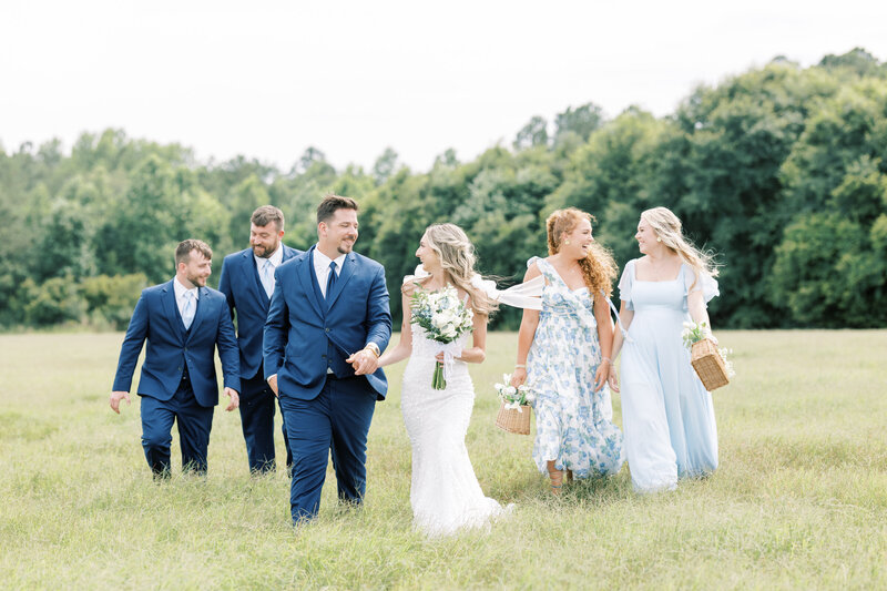 bride and walking with bridesmaids and groomsmen