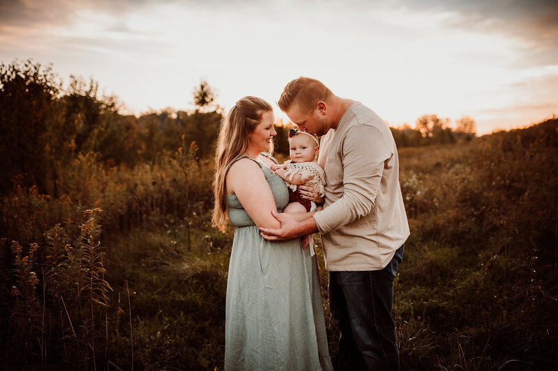 Family portrait by Rebecca Joslyn Photography in an Indiana field