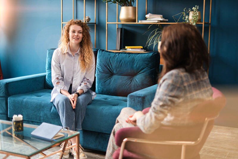 Therapist and client sitting in conversation during a counseling session representing Rooted Renewal therapy for emotional support before and after bariatric surgery at Rooted & Nourished Psychotherapy