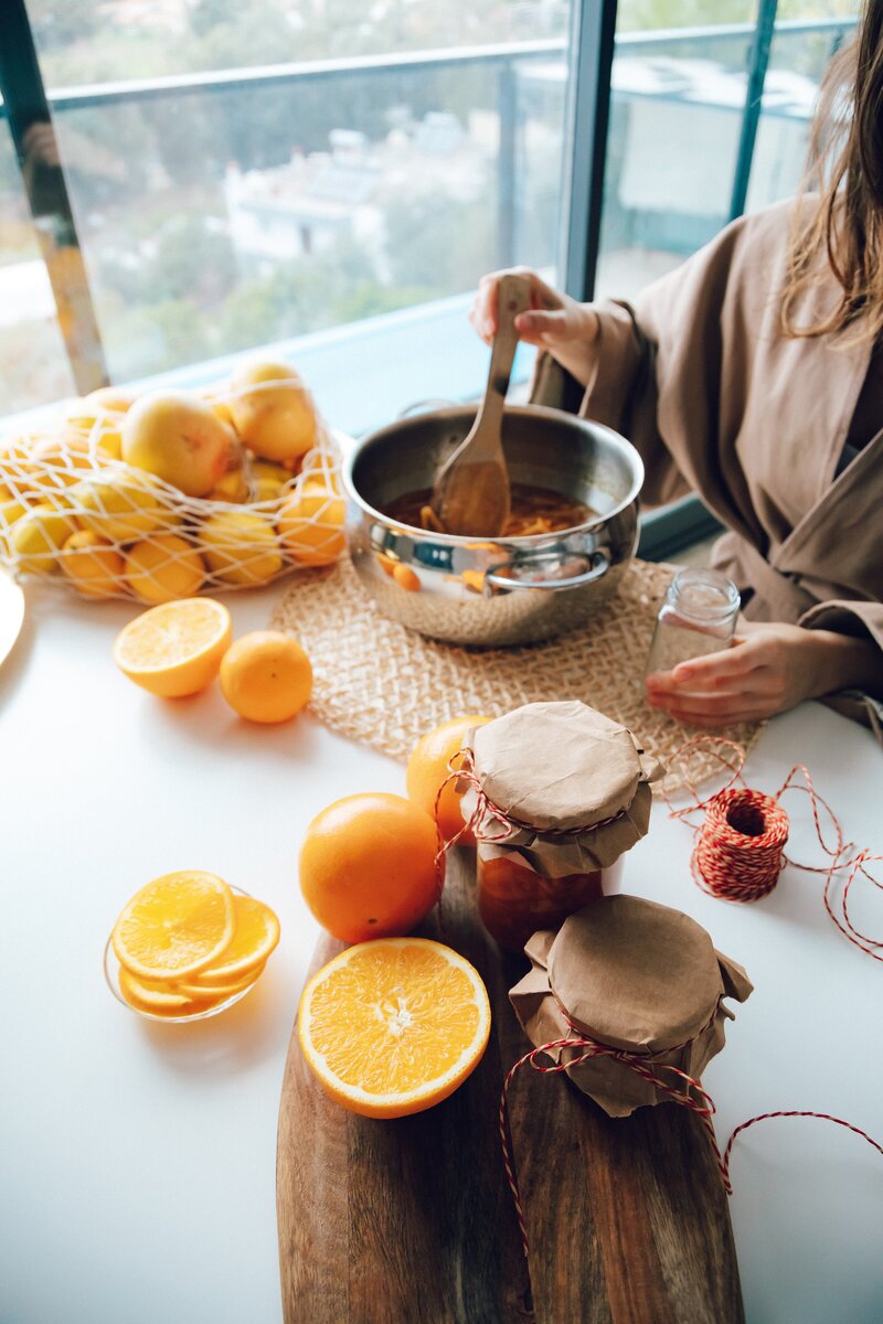 Woman working  on making an orange drink