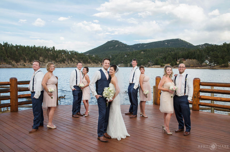 Wedding party formal portrait on the back deck of the Evergreen Lake House in Colorado