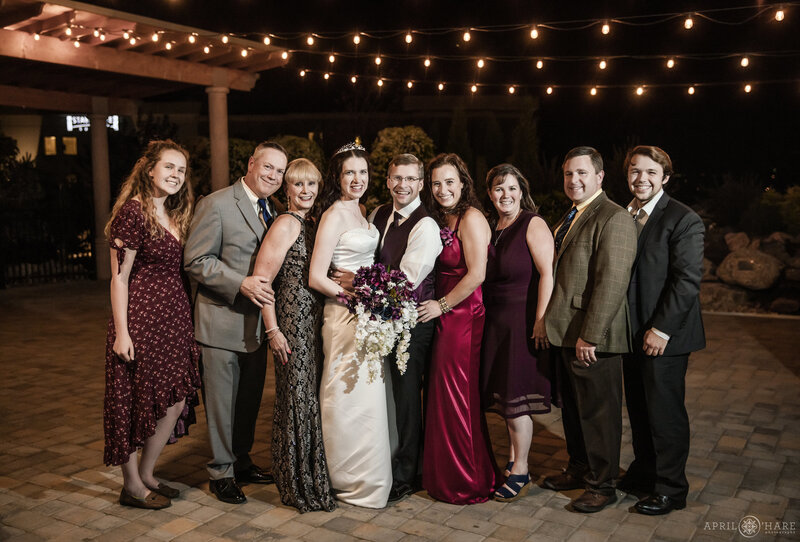 The outdoor courtyard lit up with patio string lights at night Ashley Ridge Weddings